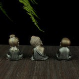 Statue Bouddha à Genoux