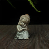 Statue Bouddha à Genoux