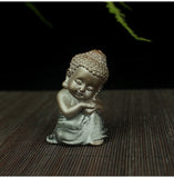 Statue Bouddha à Genoux